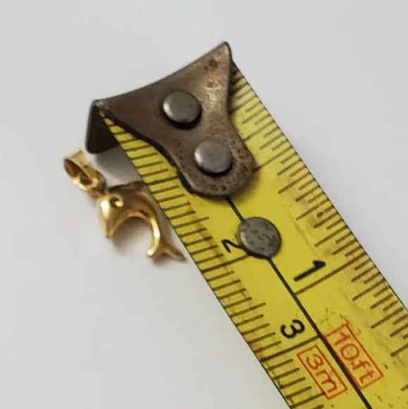 14K Gold Dolphin Pendant – A Playful Symbol of Grace and Freedom